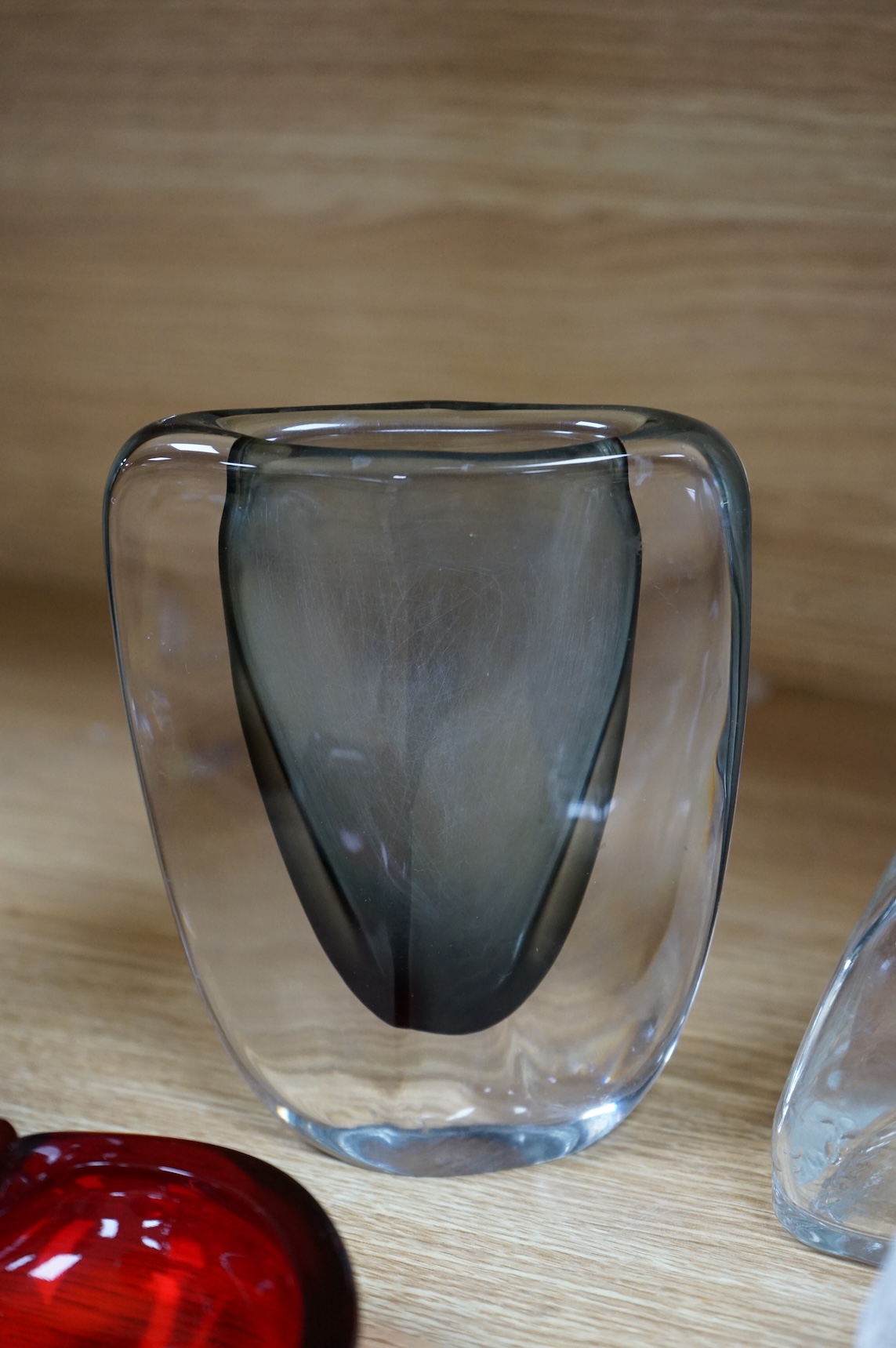 A collection of glassware including a Kosta Boda snowball pot and an Evian advertising water bottle, largest 23cm high